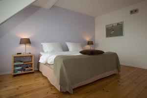 A bed or beds in a room at B&B 7de Hemel