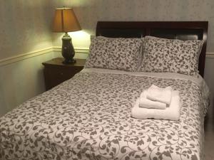Postel nebo postele na pokoji v ubytování Vancouver Homestay Inn
