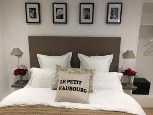 Le Petit Faubourg 객실 침대