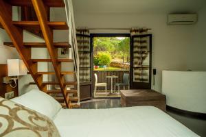 Postel nebo postele na pokoji v ubytování Hotel B Lodge
