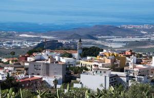 a view of a city from a hill with buildings at La Bodega Casa Rural, Tenerife. in San Miguel de Abona