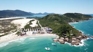 an aerial view of a beach and the ocean at Cris Hotel in Florianópolis