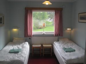 Posteľ alebo postele v izbe v ubytovaní Skiers Inn