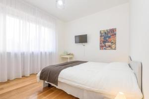 Postel nebo postele na pokoji v ubytování Maison Al Parco