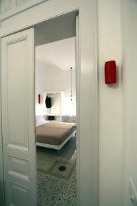 Postel nebo postele na pokoji v ubytování Re Ruggero Rooms