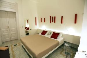 Postel nebo postele na pokoji v ubytování Re Ruggero Rooms