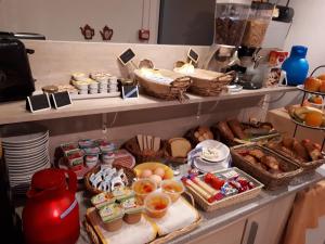 a buffet with many different types of food on display at La Caravelle in Riom