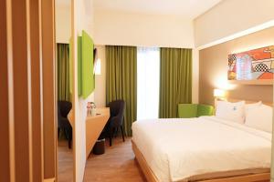 Ένα ή περισσότερα κρεβάτια σε δωμάτιο στο G'Sign Style Hotel