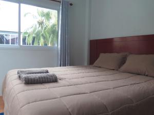 Postel nebo postele na pokoji v ubytování Your Place Inn Surin