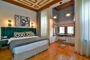 a bedroom with a bed and a desk in it at Istanbul Life Hotel in Istanbul