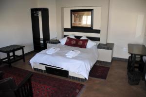 מיטה או מיטות בחדר ב-Hadassa Guest House