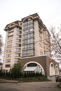 a large white building with a lot of windows at Apartment on Lukyanovska in Kyiv