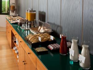 a buffet line with sandwiches and other food on it at Apartamentos TH Las Rozas in Las Rozas de Madrid