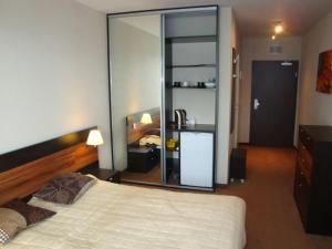 Posteľ alebo postele v izbe v ubytovaní Apartamenty Diva Kołobrzeg