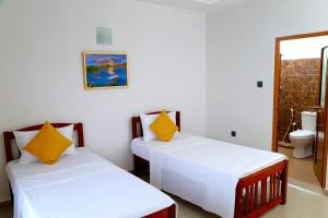 Postel nebo postele na pokoji v ubytování Villa Serene