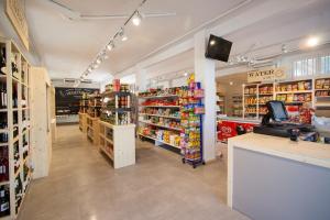 a store aisle of a grocery store with a pharmacy at Camping Joan Bungalow Park in Cambrils