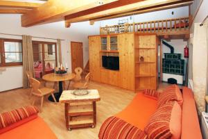 a living room with a couch and a table at Appartements Berger Kitzbühel in Kitzbühel