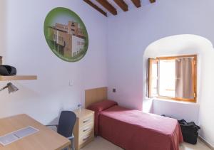Postel nebo postele na pokoji v ubytování Albergue Inturjoven Córdoba