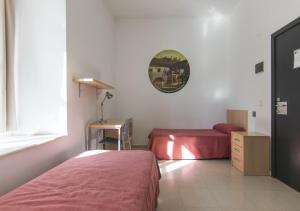 Postel nebo postele na pokoji v ubytování Albergue Inturjoven Córdoba