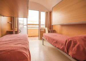 Postel nebo postele na pokoji v ubytování Albergue Inturjoven Córdoba