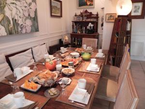 a dining room table with food on it at Cote Sud in Trôo