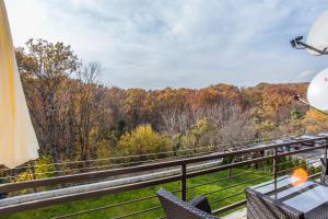 a balcony with a view of the woods at Houzzz21 in Zagreb