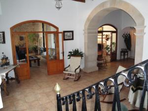 a living room with a staircase and an archway at Agroturisme Son Llado in Campos +51 photos