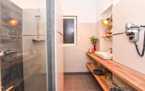 a bathroom with a shower and a sink at Parliament & River View Apartments in Bucharest +169 photos