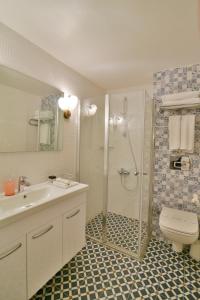 a bathroom with a shower and a sink and a toilet at Istanbul Life Hotel in Istanbul