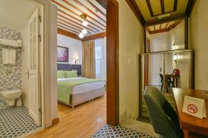a hotel room with a bed and a bathroom at Istanbul Life Hotel in Istanbul