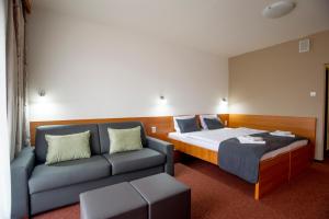 Postel nebo postele na pokoji v ubytování Wellness Hotel Thermal