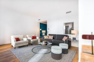 a living room with a couch and a table at Slow Suites Bellas Artes in Madrid