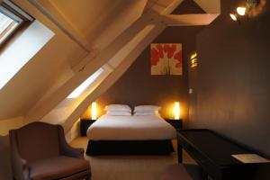 מיטה או מיטות בחדר ב-Logis La Ferme Du Vert