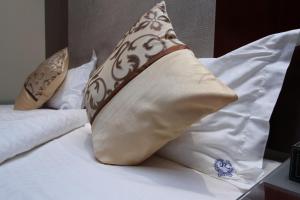 Postel nebo postele na pokoji v ubytování رؤوم إن للشقق المخدومة-Raoum Inn Serviced Apartments