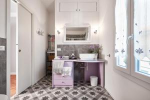 a bathroom with a sink and a pink cabinet at La Serliana - Bed&Breakfast in Vicenza