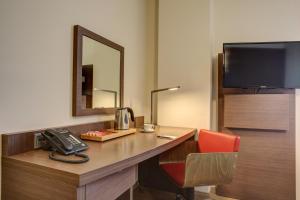 TV a/nebo společenská místnost v ubytování Hotel Orangerie