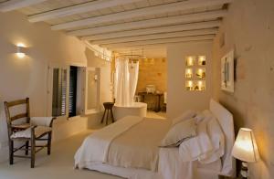 Posteľ alebo postele v izbe v ubytovaní Dimora Cala del Pozzo