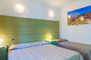 Ein Bett oder Betten in einem Zimmer der Unterkunft Hotel Montecristo