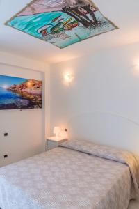 Postel nebo postele na pokoji v ubytování Hotel Montecristo + 37 fotografií