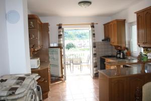 Kuchyň nebo kuchyňský kout v ubytování Apartments Sandra