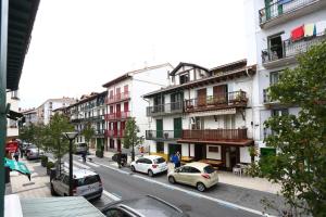a city street with cars parked on the street at Martintxo by Smiling Rentals in Hondarribia