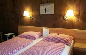 Letto o letti in una camera di Pension Feiersinger