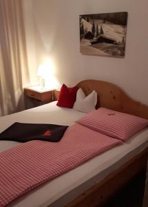 Letto o letti in una camera di Pension Feiersinger