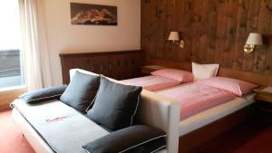 Letto o letti in una camera di Pension Feiersinger