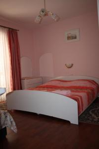 Postel nebo postele na pokoji v ubytování Apartments Sandra