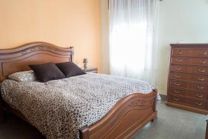 Un pat sau paturi într-o cameră la Casa Ruano