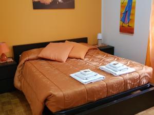 A bed or beds in a room at Domina Romae B&B