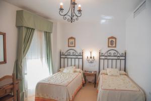 Кровать или кровати в номере Hostal DP El Pilar