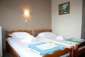 Letto o letti in una camera di Ενοικιαζόμενα Δωμάτια Ενιπεύς- Rooms Enipeas