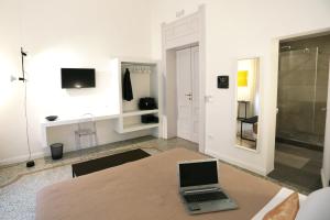 TV a/nebo společenská místnost v ubytování Re Ruggero Rooms